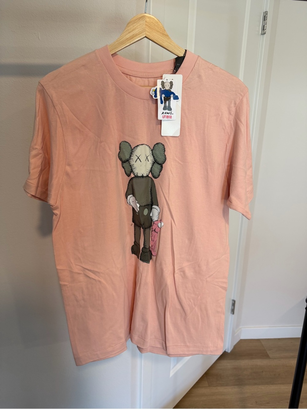 UNIQLO KAWS Pink Graphic Tee